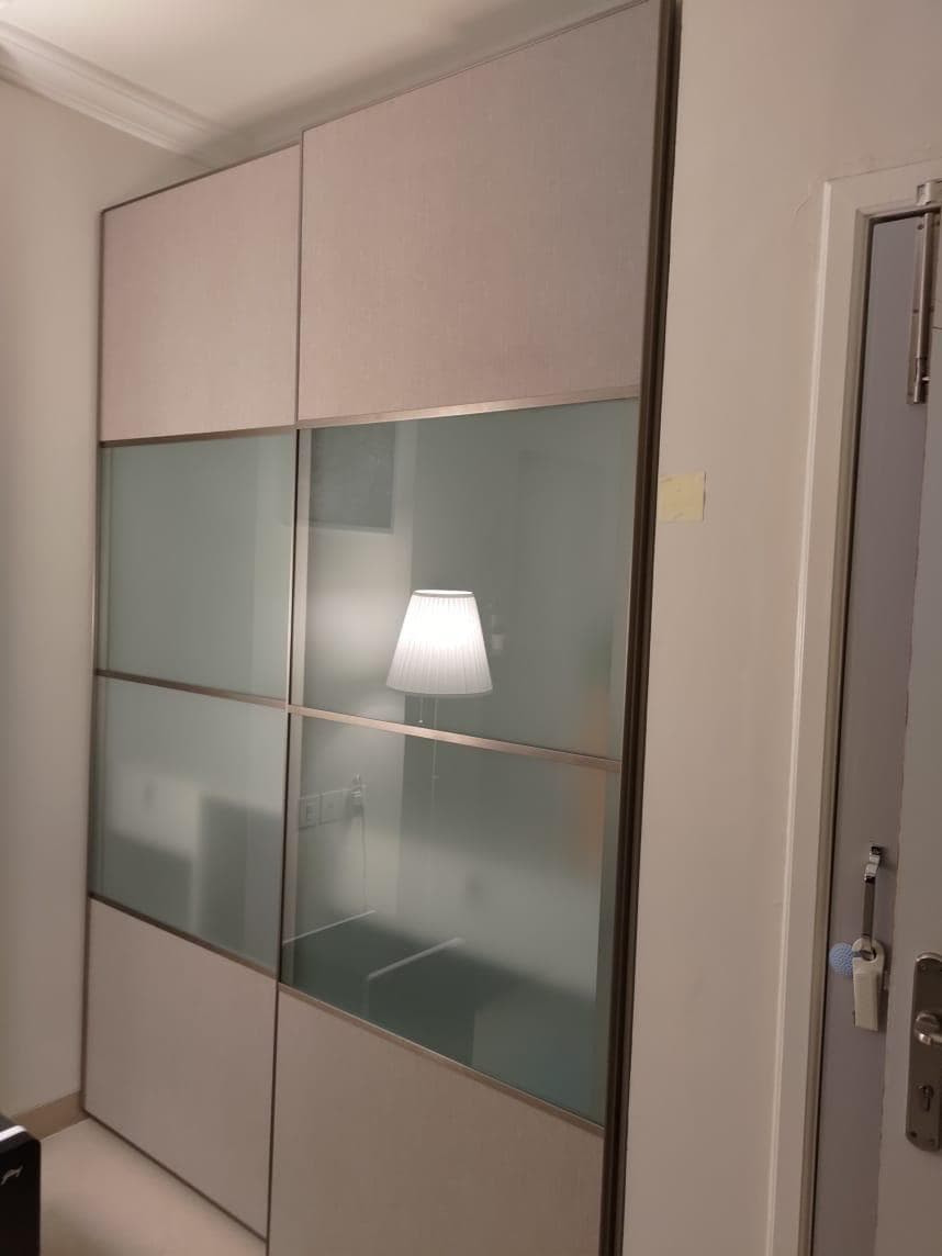 Sliding wardrobe with frosted glass panels