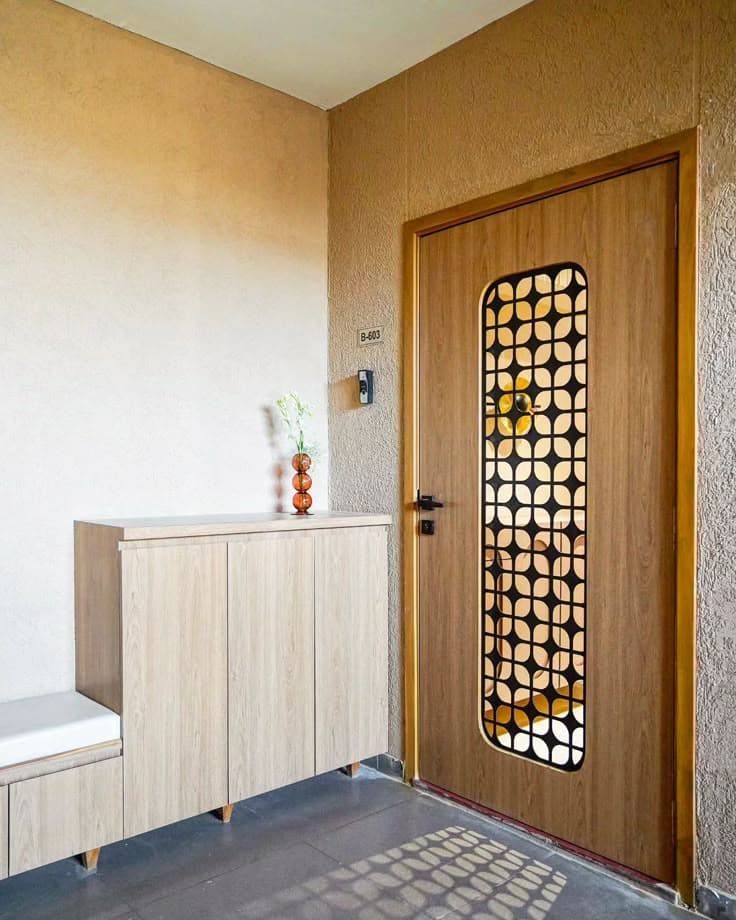 Contemporary wooden frame safety door with laser-cut metal panel