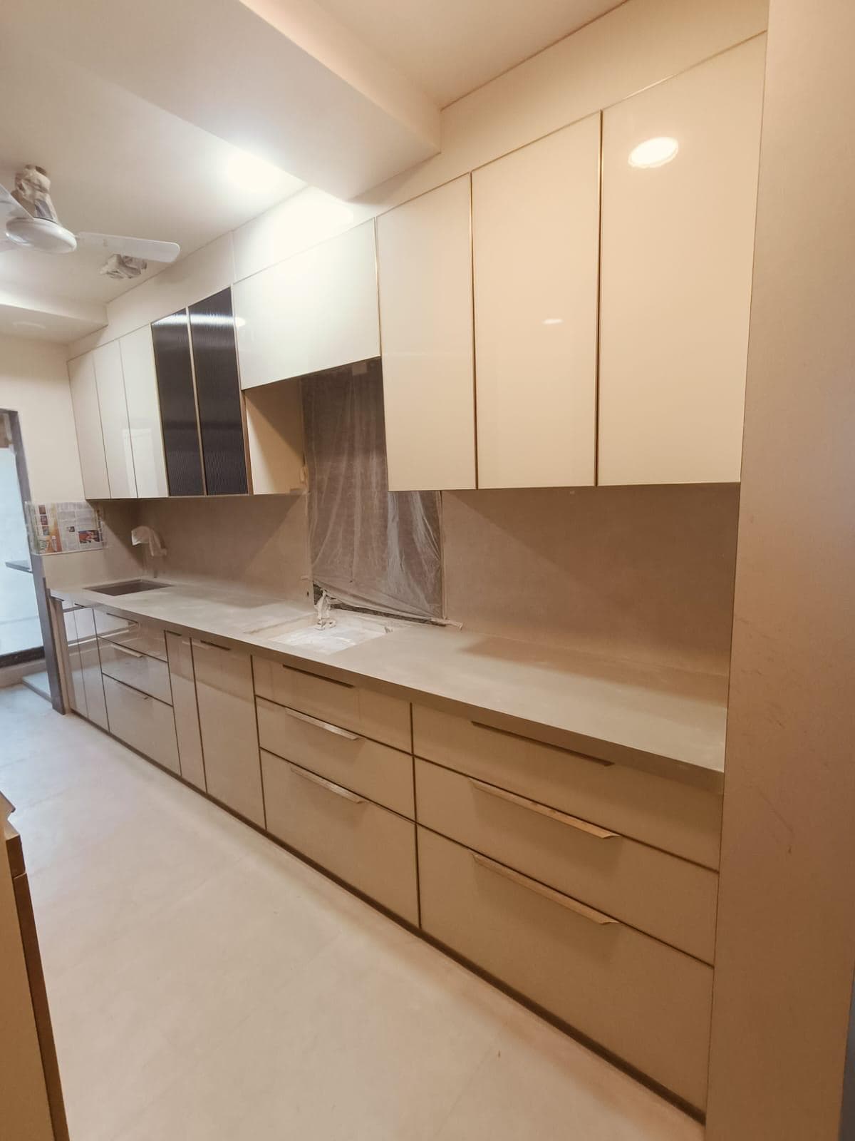Cream gloss modular kitchen