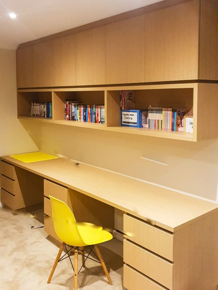 Study table with overhead library shelving