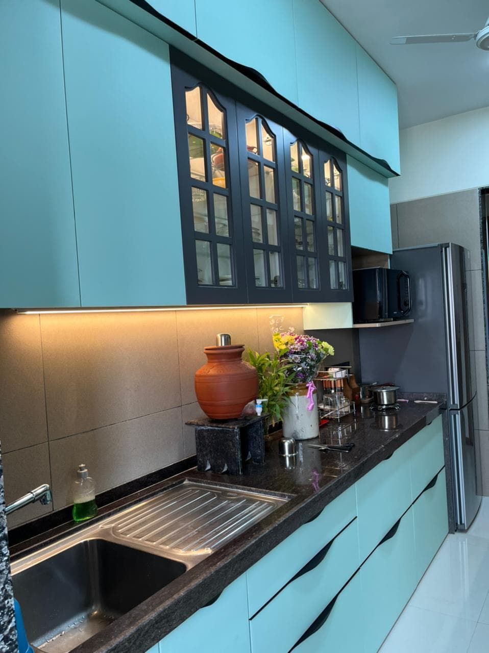 Mint laminate kitchen with glass shutters