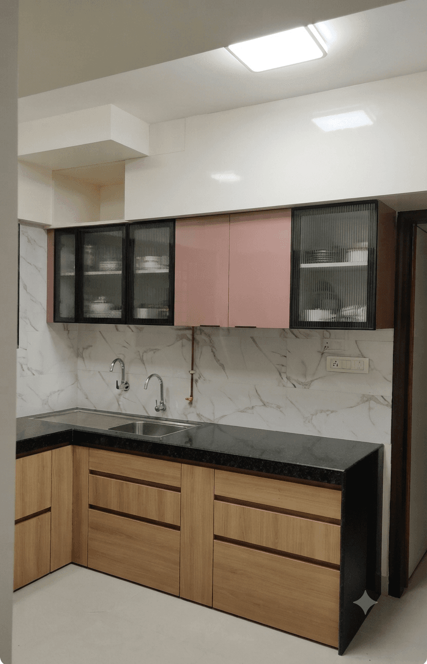 Modern L-shaped kitchen featuring pink upper cabinets and dark countertop